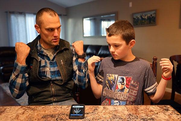 Luke Bushatz and son sharing a moment at the kitchen table