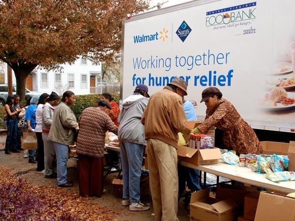 People lined up at food pantry table