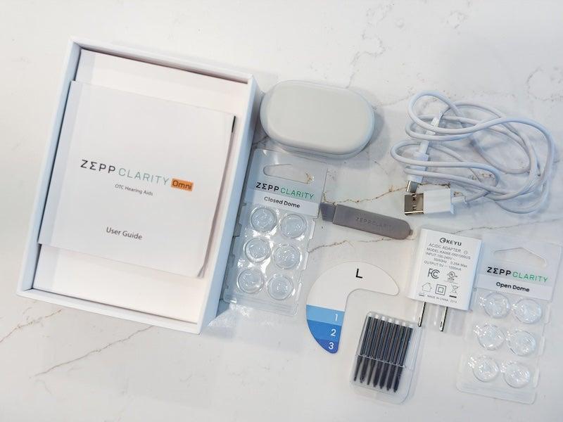 The Zepp Clarity Omni hearing aid and everything that comes with it inside its box