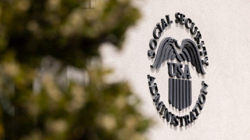 The emblem of the Social Security Administration on an office building outside.