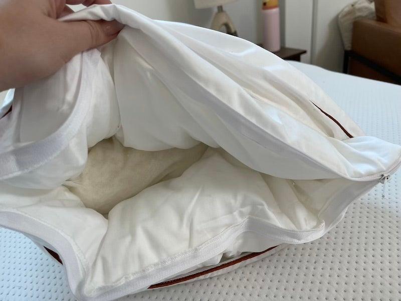 A tester displays the interior of the Saatva latex.