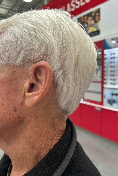 Jabra Enhance Pro hearing aid in man's left ear