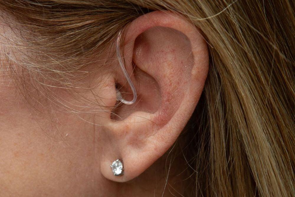 Lexie hearing aid in woman's left ear