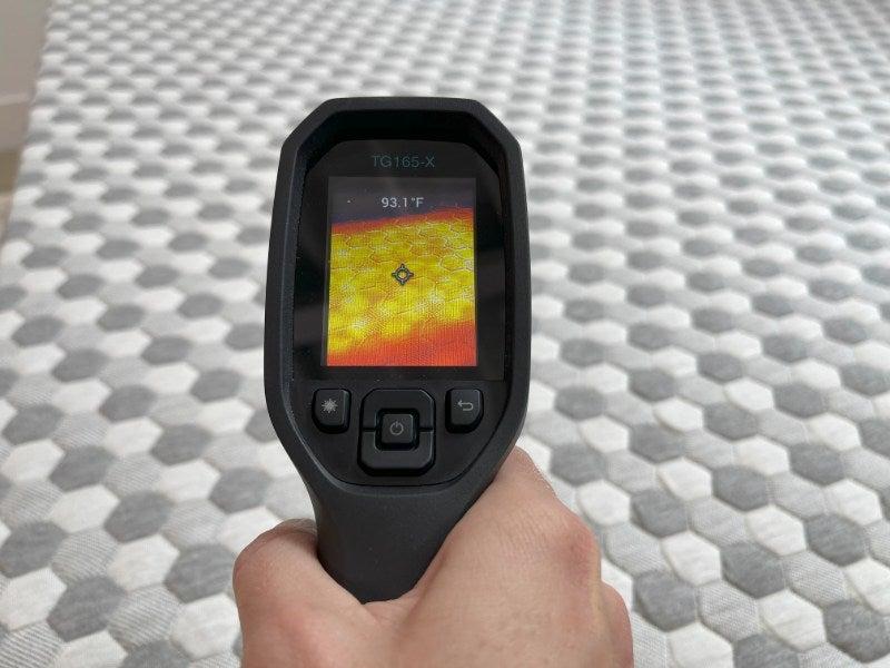 A heat gun pointed at the Layla mattress topper