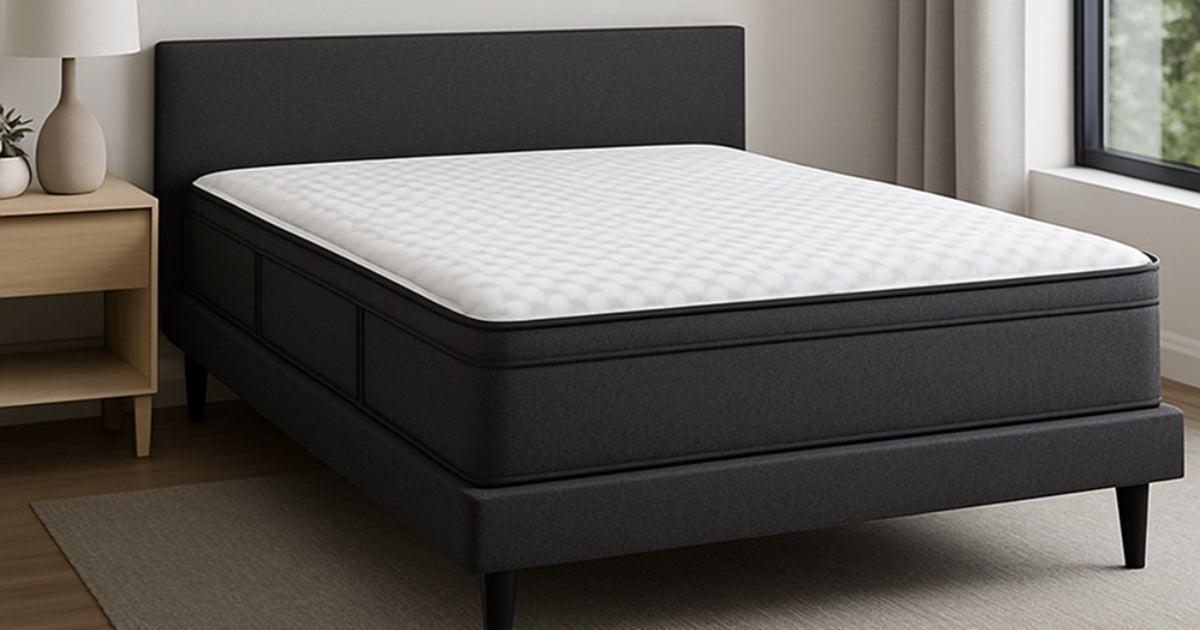 A Plank mattress on a black bedframe