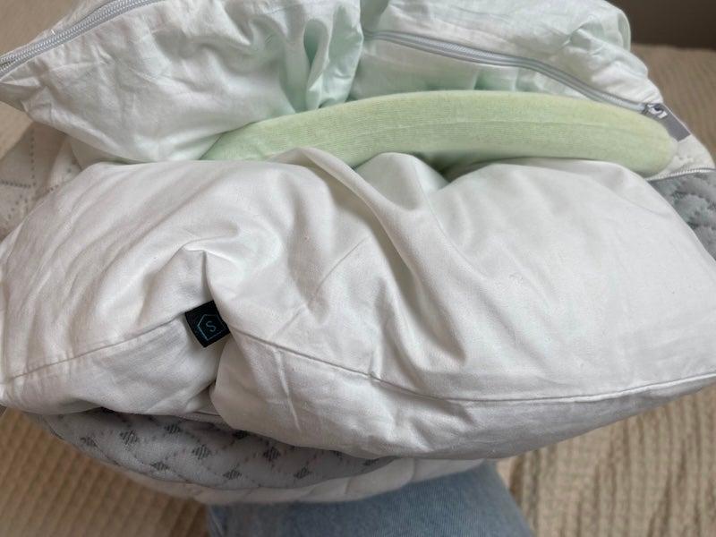 The insides of the Luxome LAYR pillow: a foam piece, and two zippered compartments