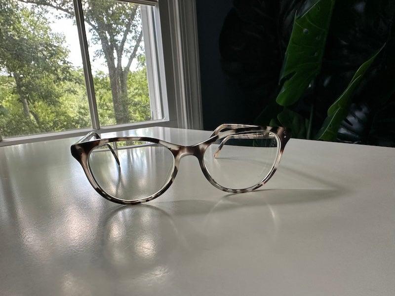 Warby Parker tortoiseshell frames on a white table
