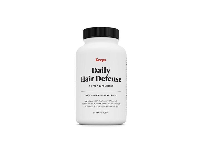 A bottle of Keeps Daily Hair Defense supplements