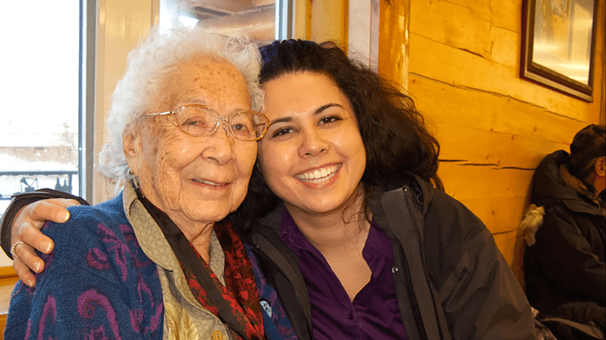smiling grandmother and granddaughter