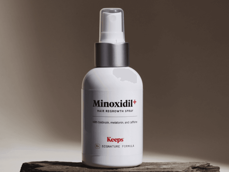 A bottle of Keeps Topical Minoxidil Hair Regrowth Spray