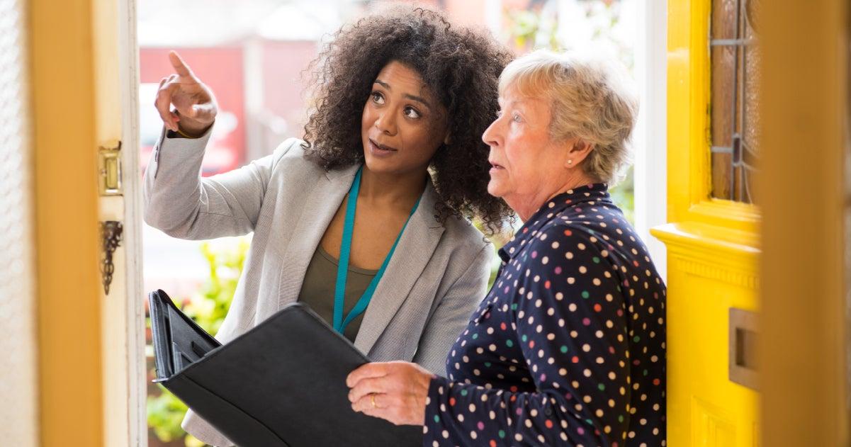 A younger, black woman is advising an older caucasian woman on home modifications as she ages in place.