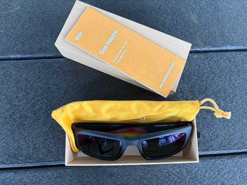 Sunglasses and a dandelion-yellow glasses case
