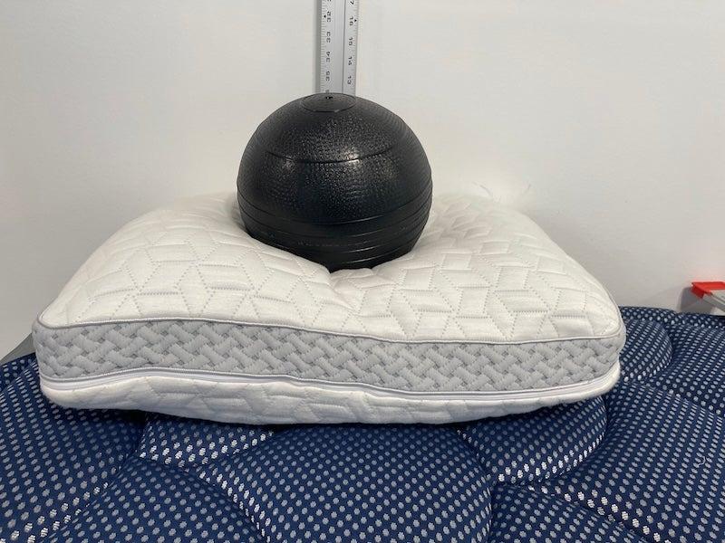 A medicine ball is cradled on the Luxome LAYR