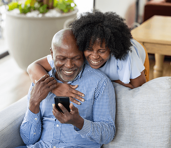 older couple smiling at cellphone