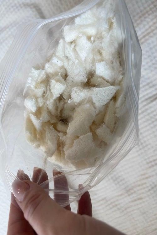 The latex and kapok fiber fill inside the Avocado Green pillow.