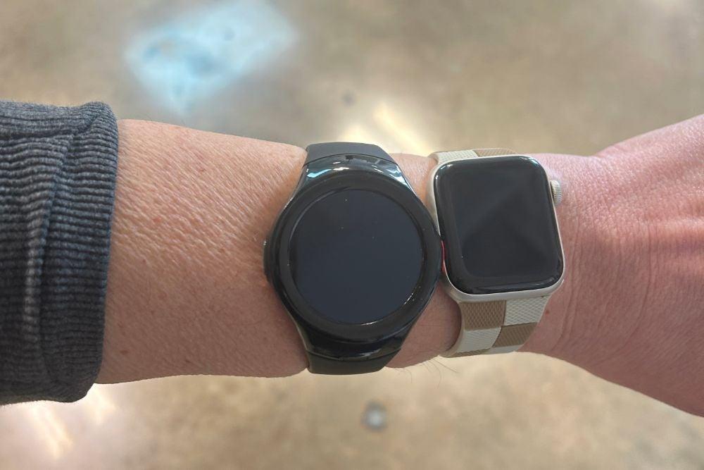 The Medical Guardian MGMove next to the Apple Watch on a person’s wrist