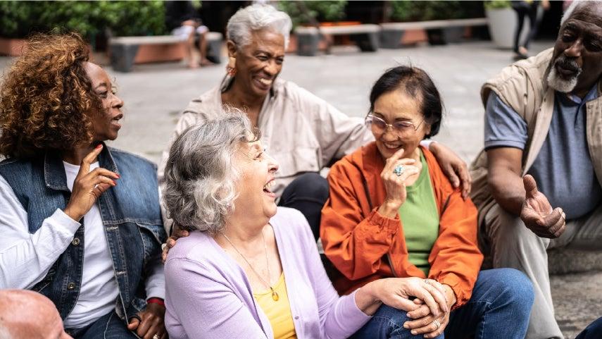 Group of older adults laughing.