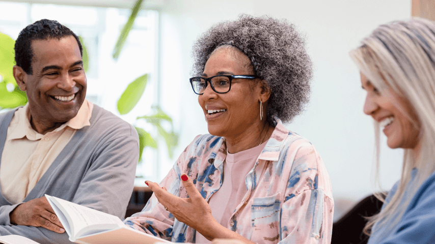 A group of older adults at a table