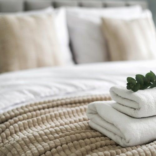 White sheets on a well-made bed