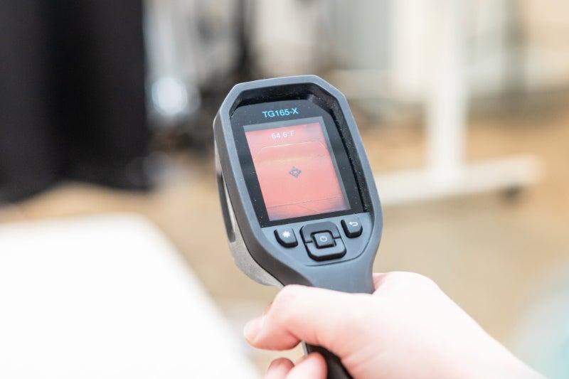 A heat sensing gun aimed at the Nectar Premier Hybrid mattress