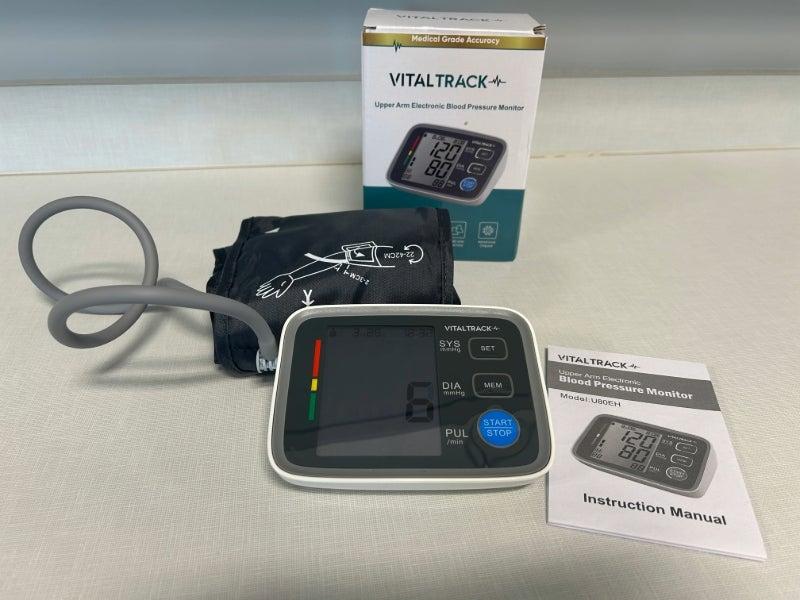 The VitalTrack Pro Blood Pressure Monitor box, device, cuff, and user manual