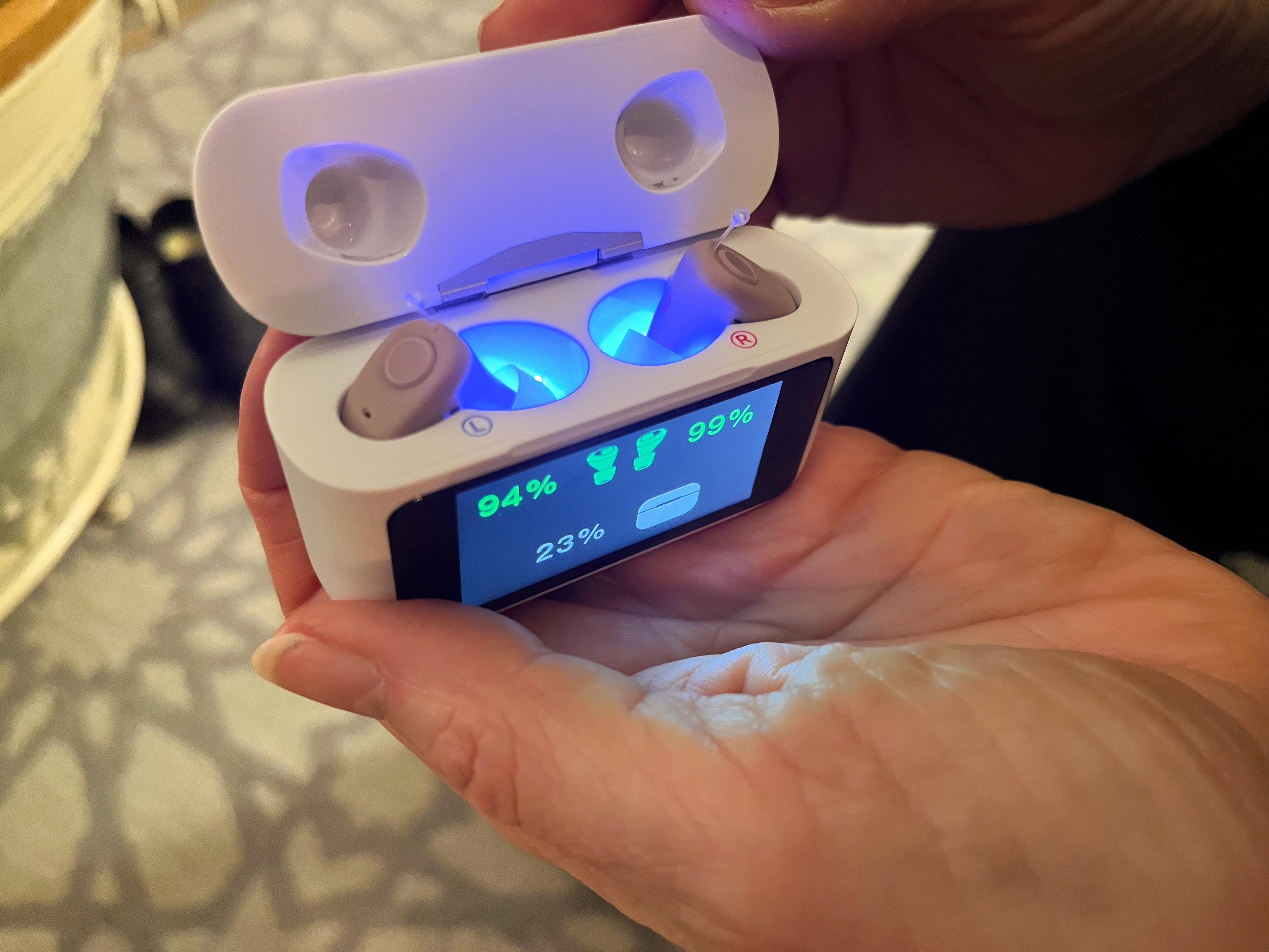 The Audien Atom X CIC hearing aids in their charging case