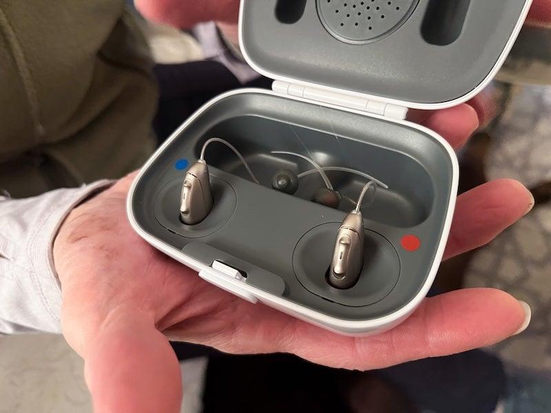 The Audicus Omni 2 hearing aids in their charging case
