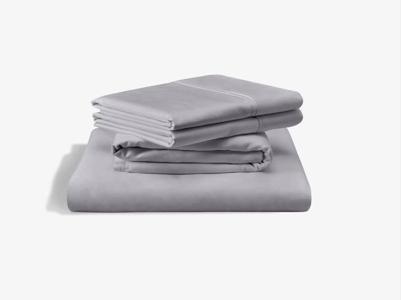 A set of grey TEMPUR-Pedic Classic Cotton sheets against a white background
