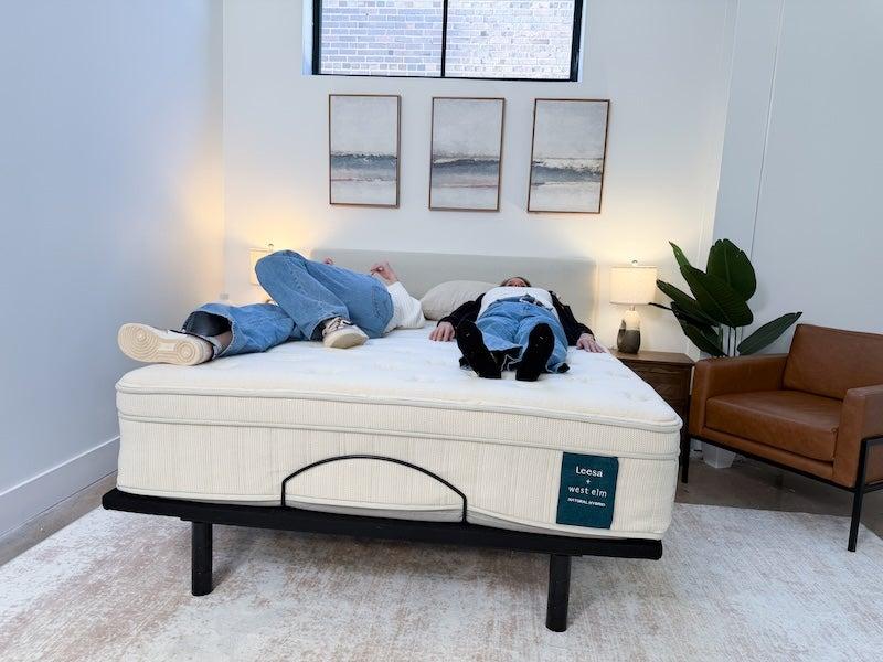 Two women lie on the Leesa Natural mattress