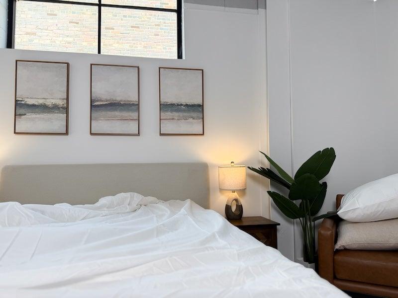 The Silk & Snow Percale Cotton Sheet Set on a mattress