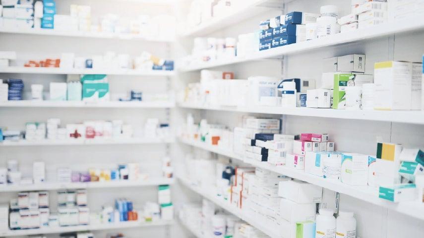 A pharmacy shelf with medicine.