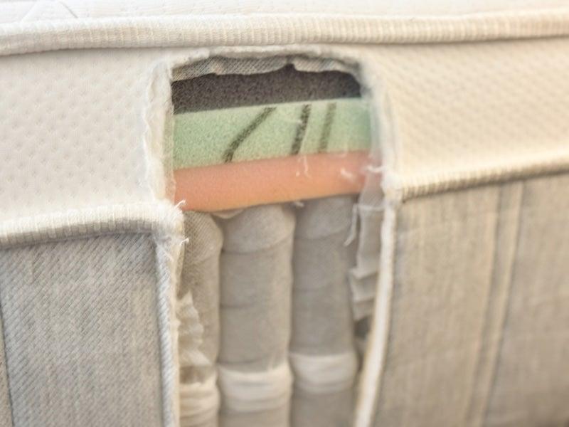 The Leesa Sapira Chill mattress cut open to reveal its individually wrapped coils and foam layers.