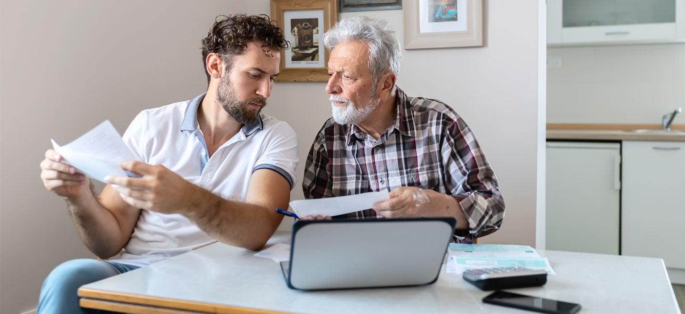 A senior father and his son are discussing his financial troubles and trying to figure out a budget.