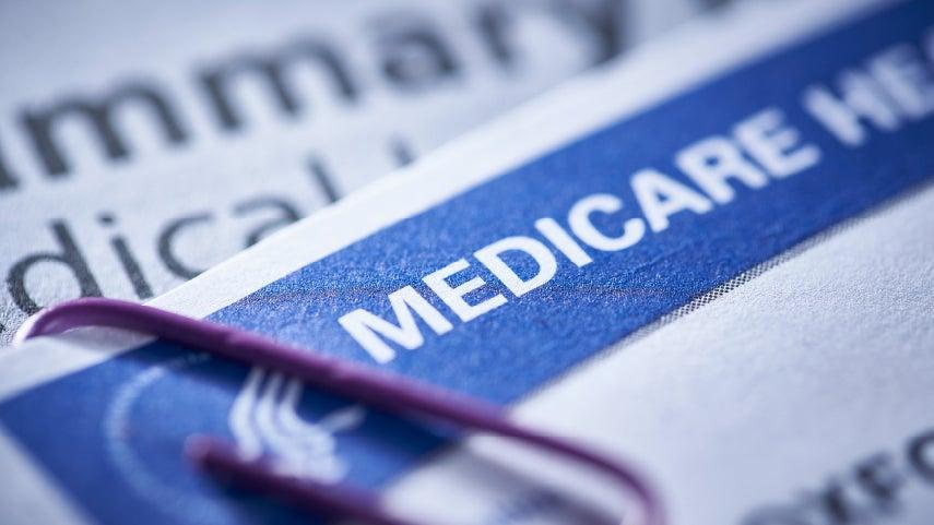 close-up of Medicare card and paperclip