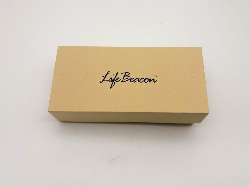 LifeBeacon arrives in a light tan box with black cursive font
