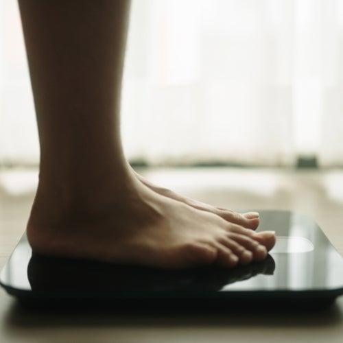 Two feet standing on a scale