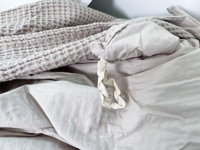 A close up of the Silk & Snow Waffle Knit Duvet Cover