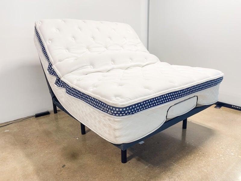 The WinkBed Luxury Firm hybrid mattress on an adjustable base