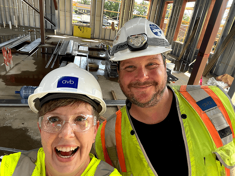 Smiling Kim Phillips and Man in hard hat