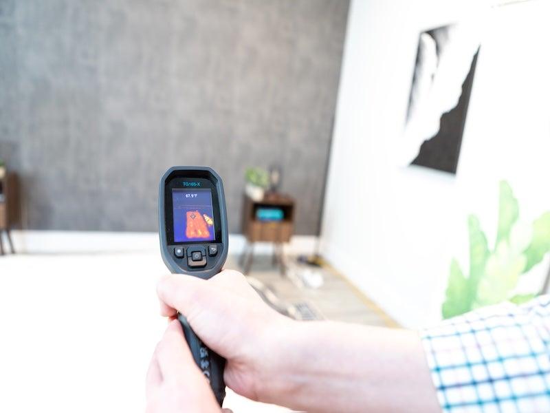 A heat gun pointed at the Brooklyn Bedding Aurora Luxe Cooling mattress