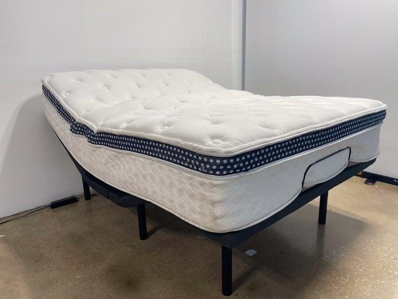 The WinkBed Luxury firm hybrid mattress on an adjustable bed frame.
