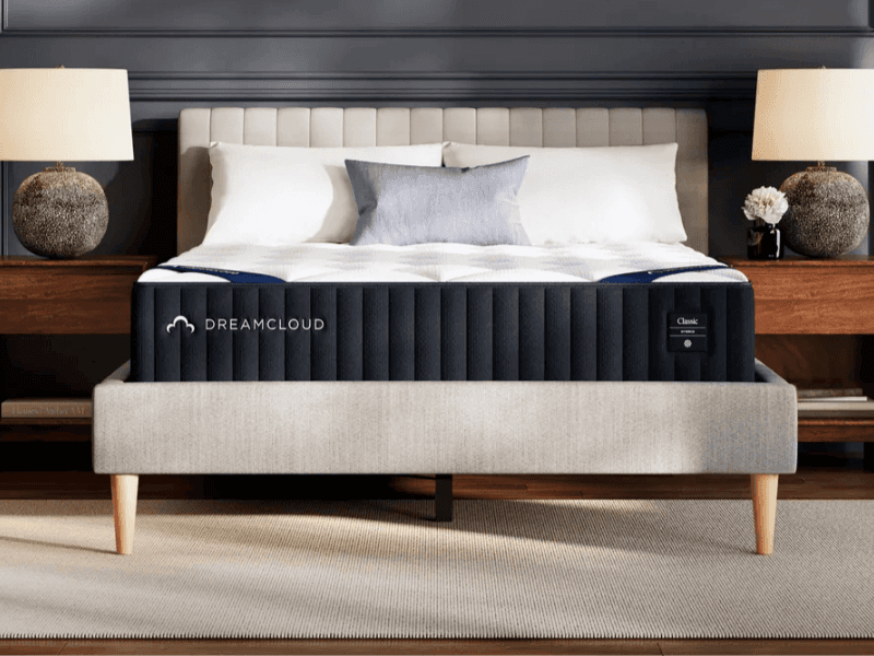 The DreamCloud Classic Hybrid mattress on a grey frame
