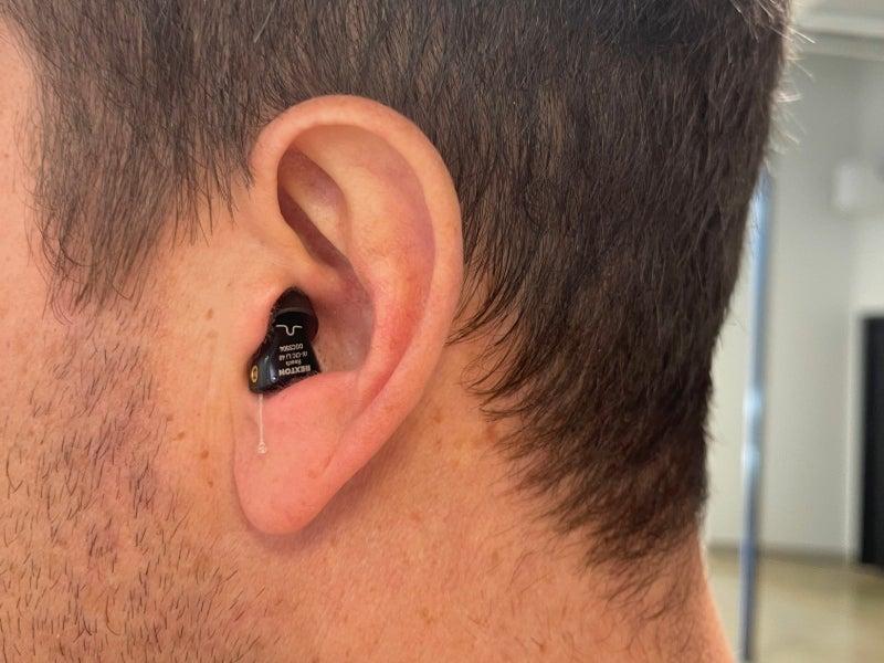 A man wearing the Audicus Mini 2 hearing aids