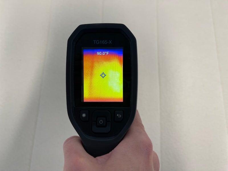 A heat gun measures the temperature of the Birch Plush Organic