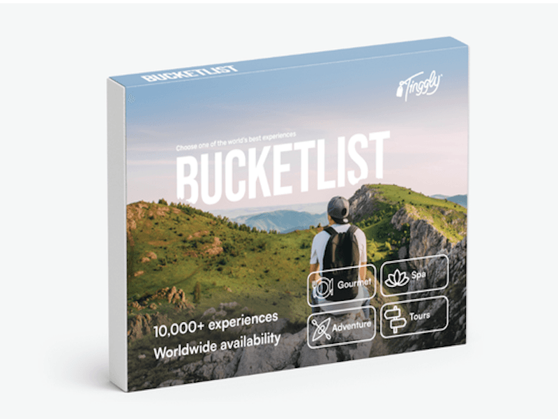 Gift box with picture of a person with a backpack overlooking a scenic mountain view; text includes "Bucketlist" and icons for experiences like "Gourmet" and "Adventure"