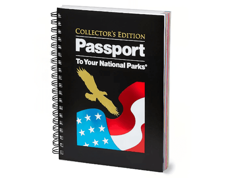 Black spiral-bound book with picture of an eagle and American flag, reading “Collector’s Edition Passport to Your National Parks”