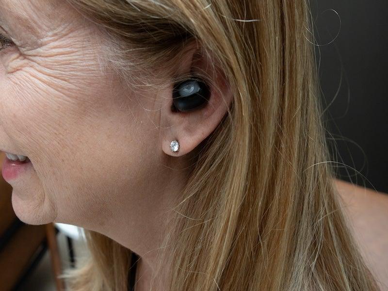 The Eargo Link earbud-style hearing aid in a woman’s ear