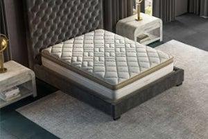 Saatva Solaire mattress on bed frame between two nightstands