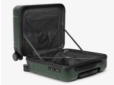 Green hard-case carry-on luggage with wheels, open to show interior.