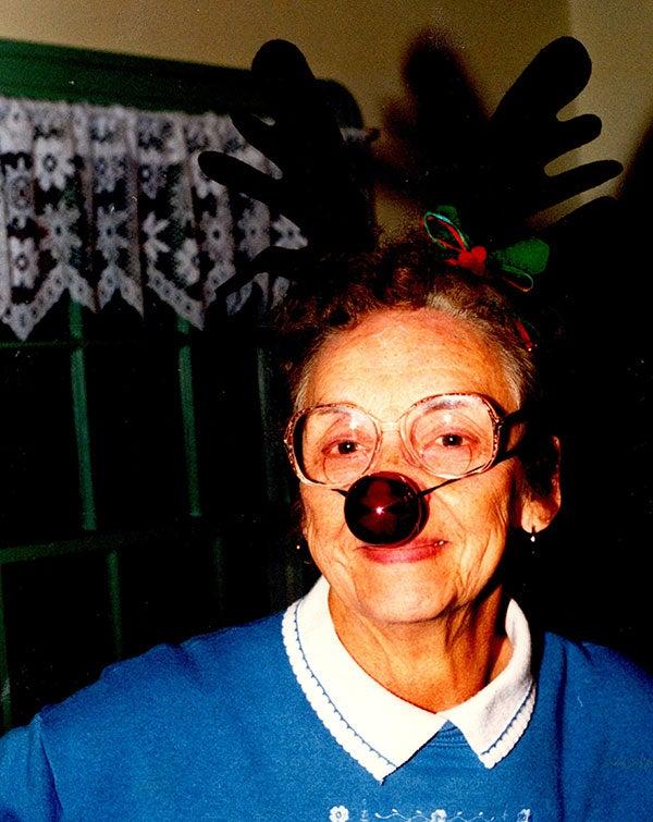 Alice wearing reaindeer nose and antlers